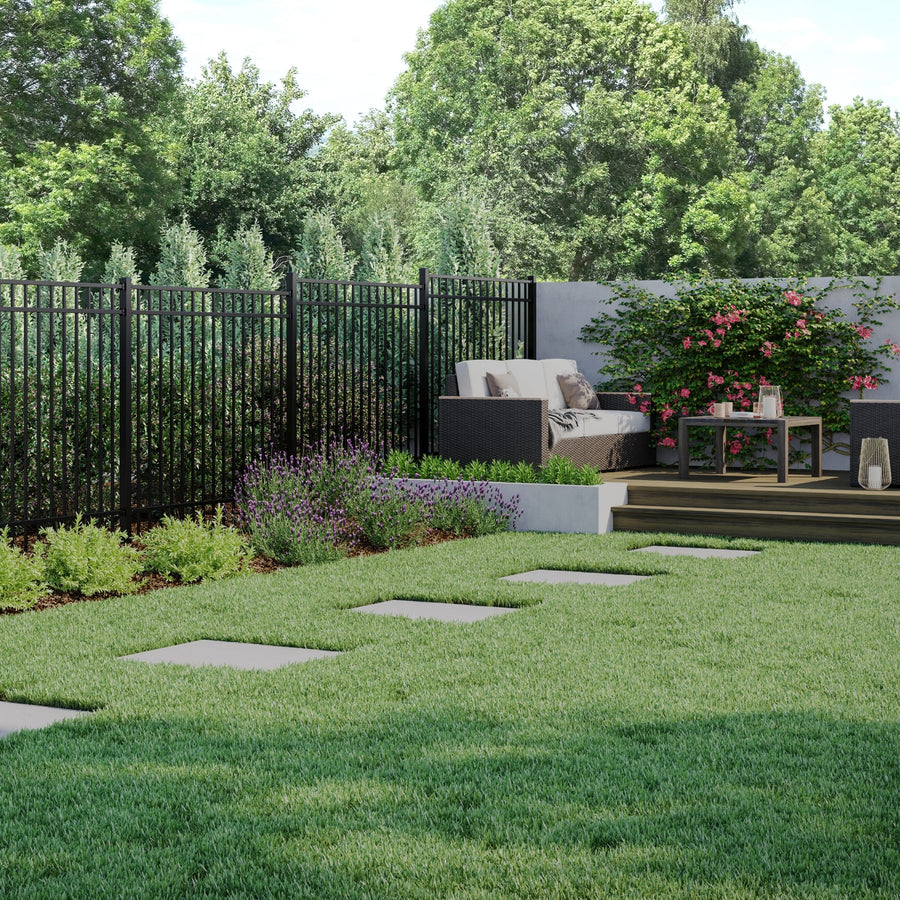 Black Deckorators aluminum fence around a backyard patio