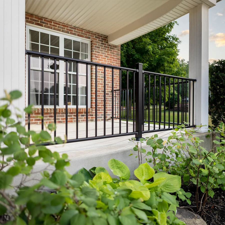 Deckorators Rapid Rail aluminum deck railing in black with square balusters on a brick home porch