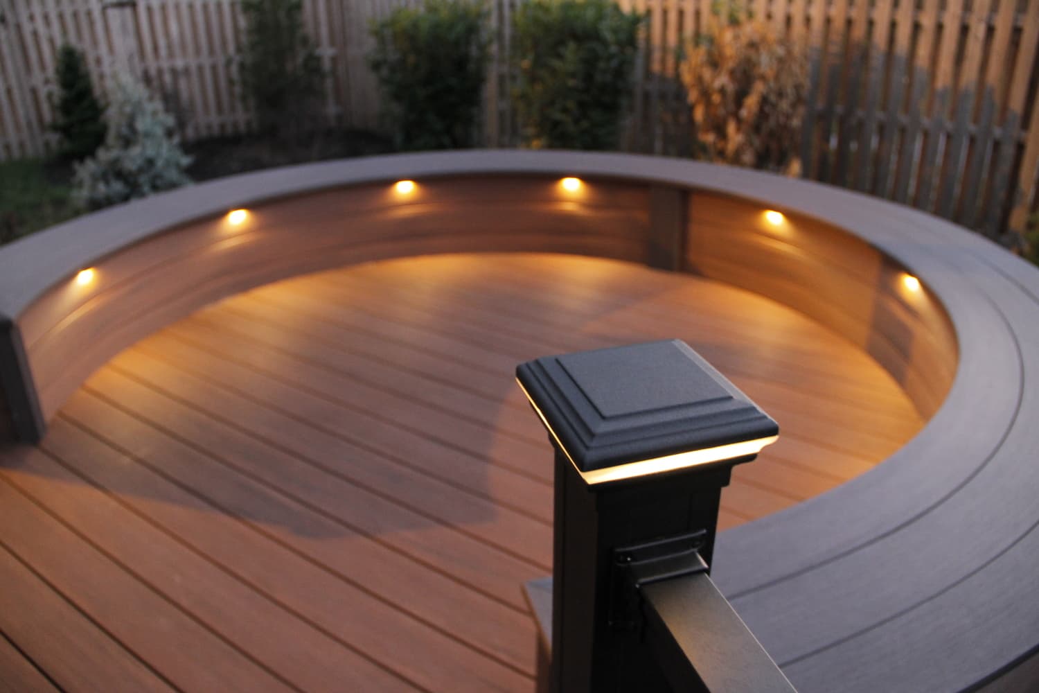 Deck lighting is used to illuminate a sitting area on a deck
