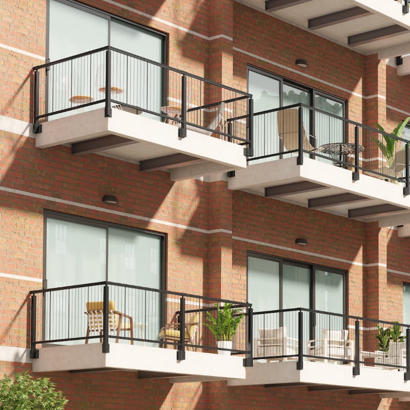 Keylink fascia mount vertical cable railing on balconies, showing the cast aluminum post brackets