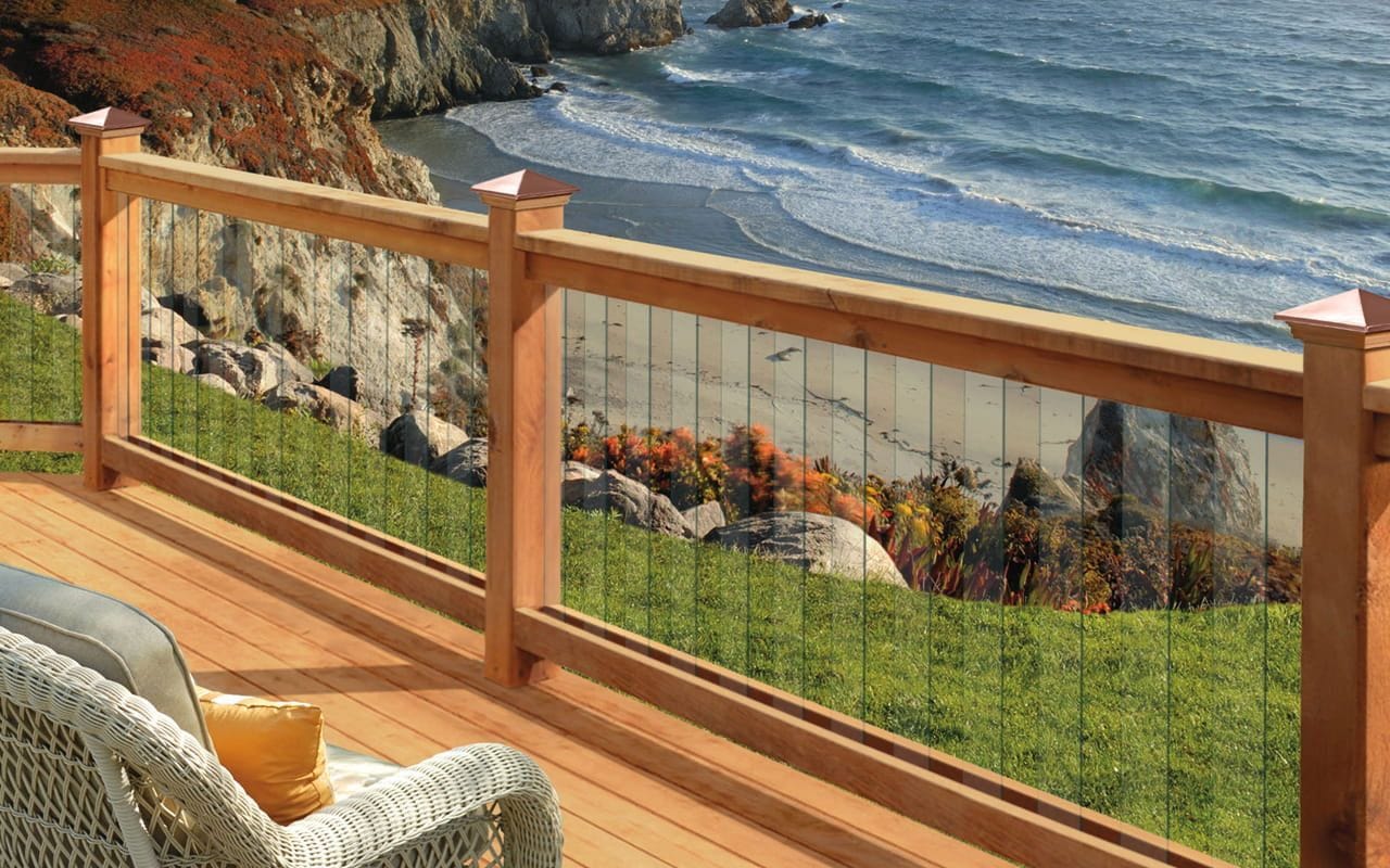 Deckorators Victoria copper post cap on railing overlooking the ocean
