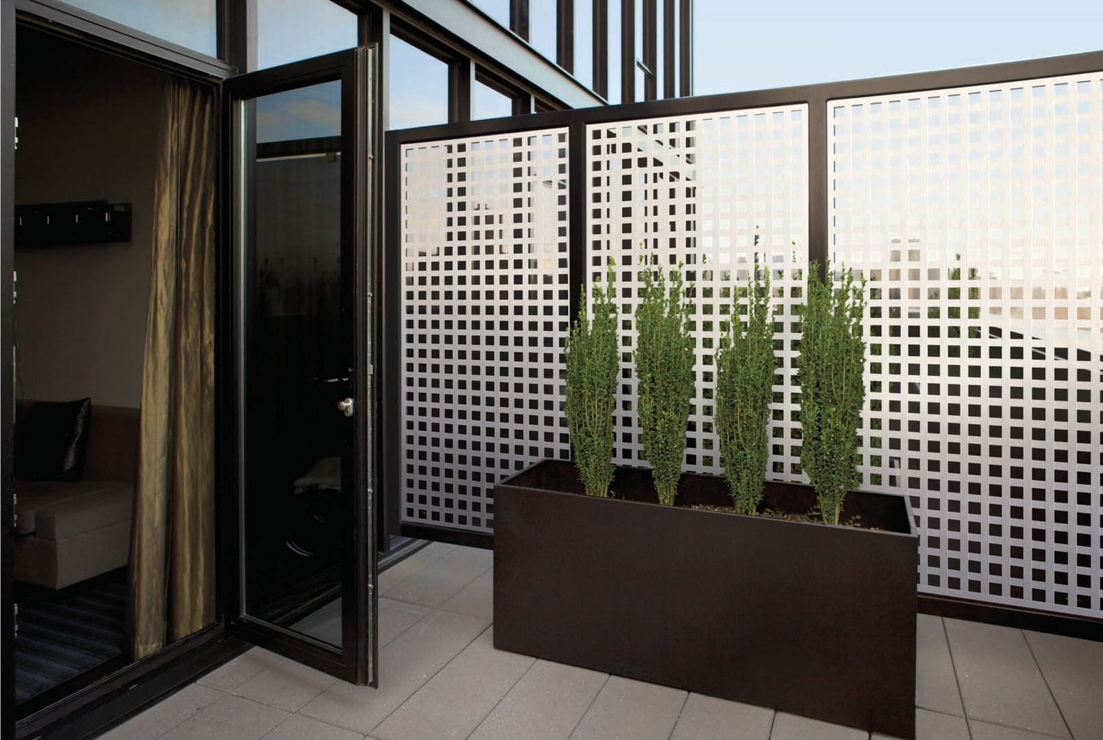 Deckorators white lattice privacy panels on a modern porch